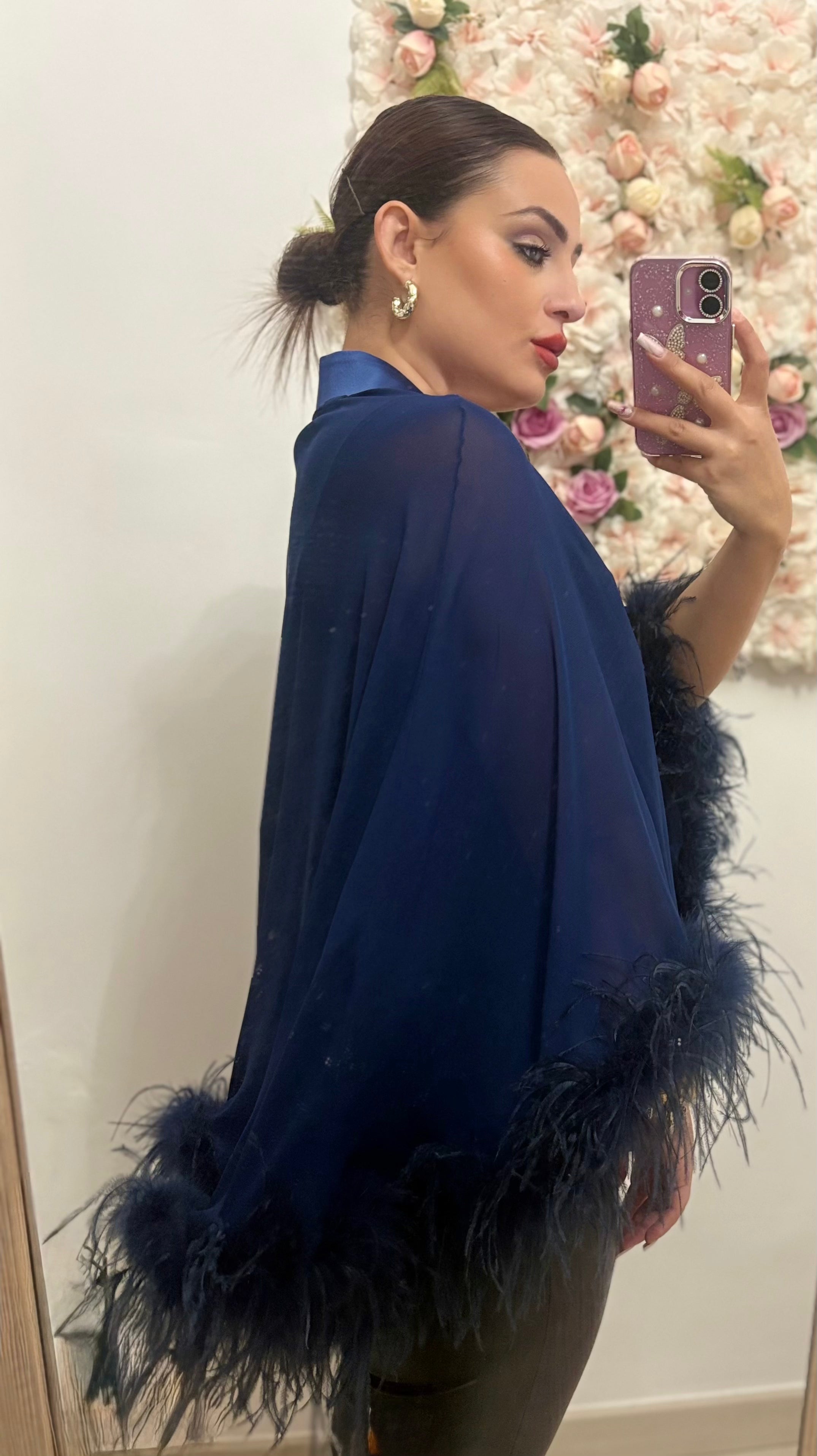 Bolero con bordi di piume