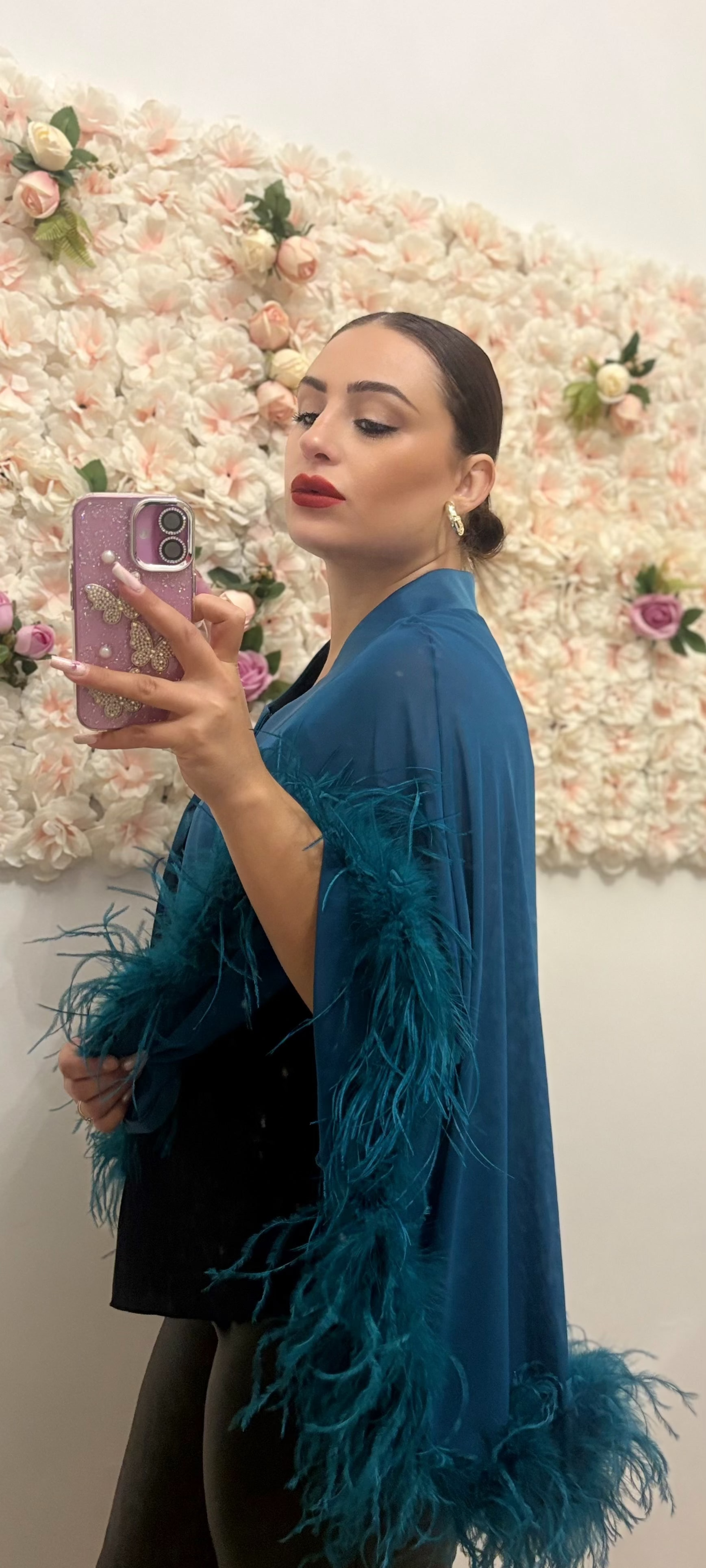 Bolero con bordi di piume